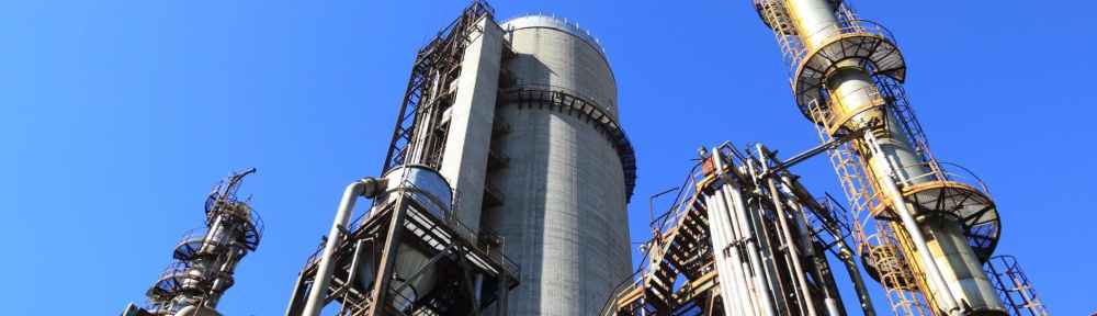 view of factory against blue sky